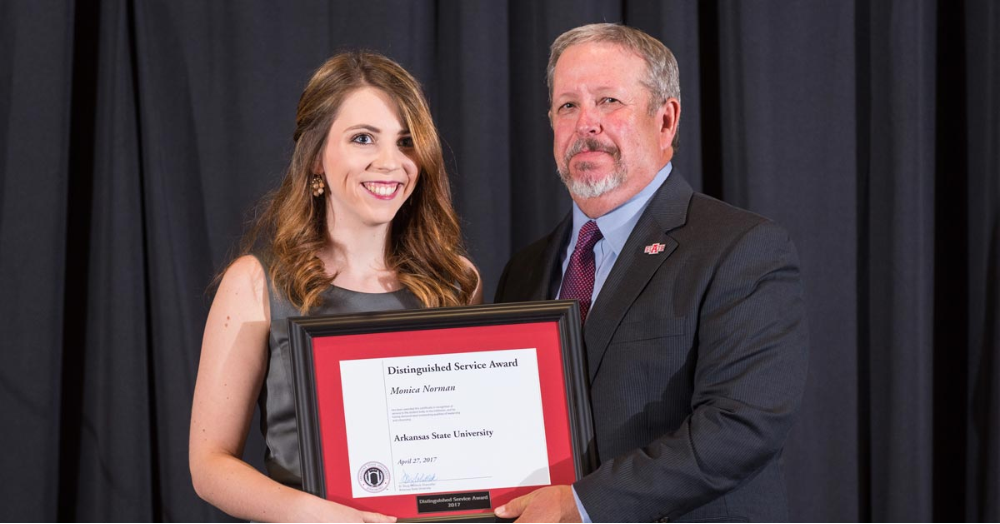 Norman Receives Distinguished Service Award