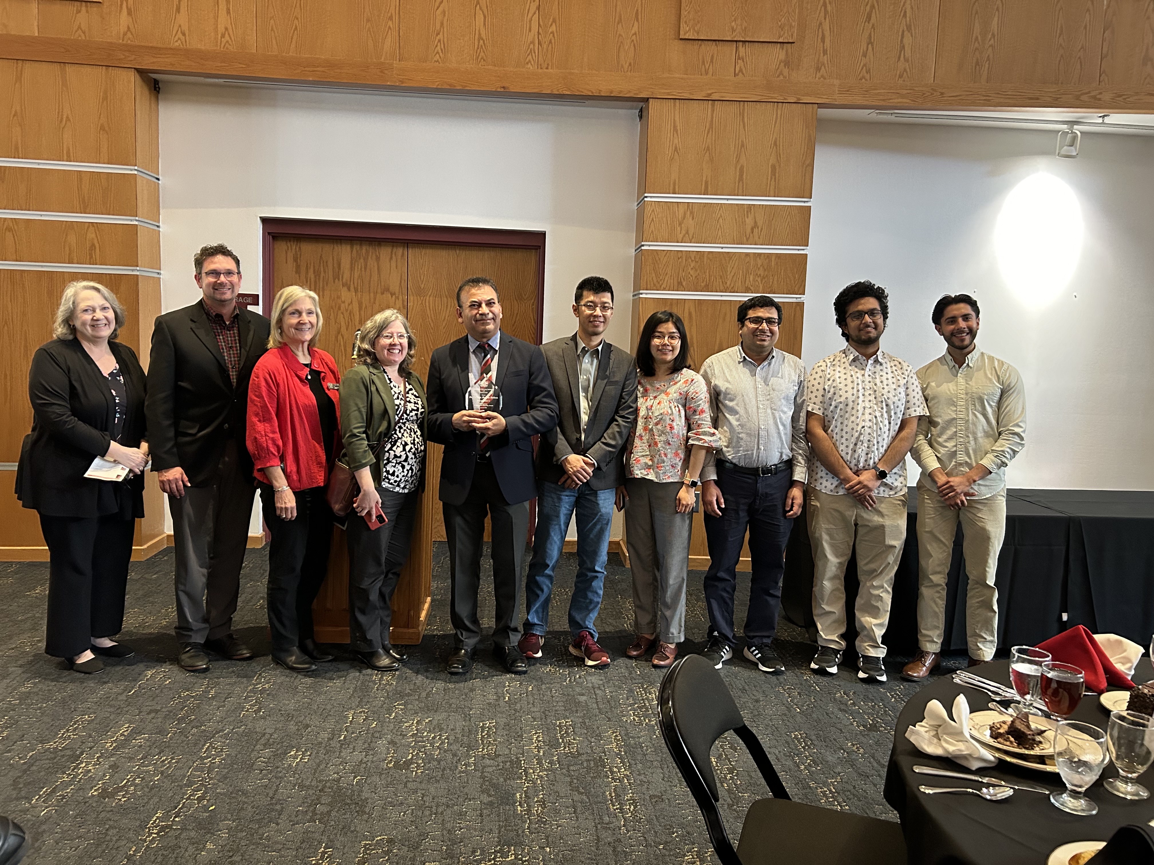 A group Excellence Award winners showing their awards